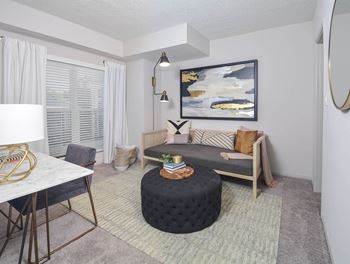A living room with a couch and a table